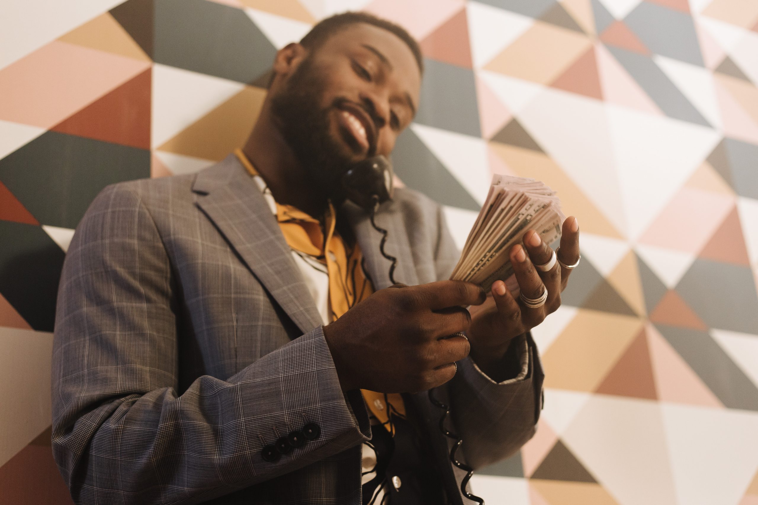 An image of a man counting money