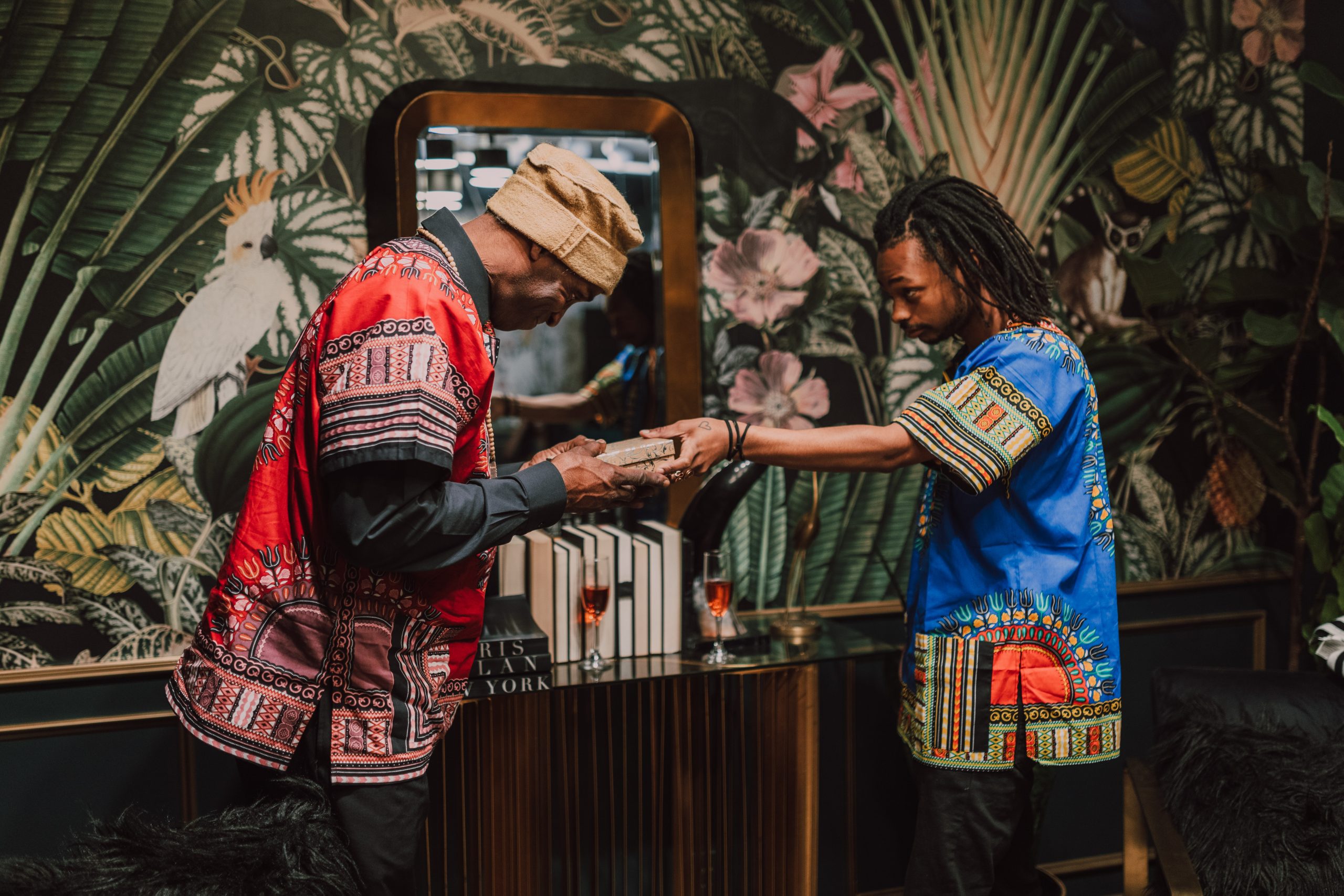 father and son exchanging gifts during the holidays