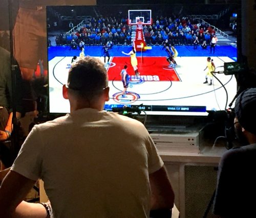 A picture of two friends playing NBA 2K.