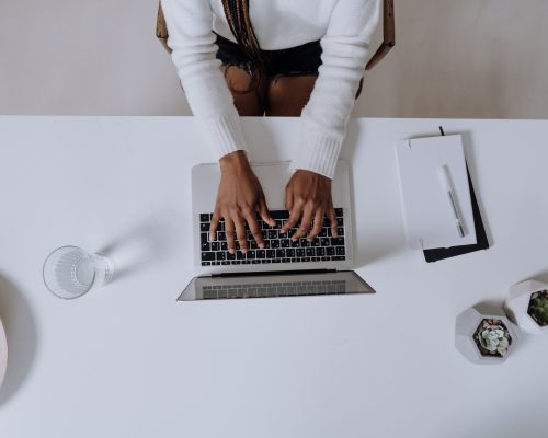 An image of a lady working on her laptop.