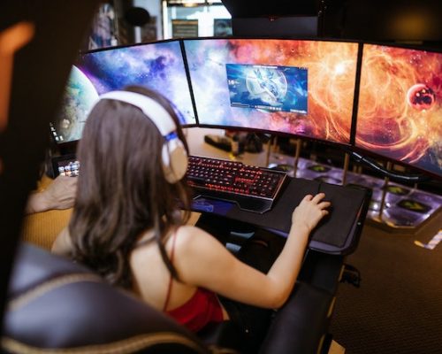 An image of a woman gaming.